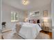 Inviting bedroom with a plush rug, natural lighting, and comfortable furnishings at 1600 S Dahlia St, Denver, CO 80222