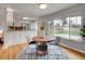 Dining area with kitchen view; overlooks backyard, with modern style and ample lighting at 1600 S Dahlia St, Denver, CO 80222