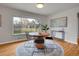 Cozy dining area featuring a round table, rug, and views of the backyard at 1600 S Dahlia St, Denver, CO 80222