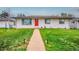 Charming home with a well-manicured lawn and a welcoming red door at 1600 S Dahlia St, Denver, CO 80222