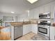Open kitchen design featuring stainless appliances and granite countertops at 1600 S Dahlia St, Denver, CO 80222