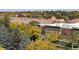 Community with views of the surrounding trees and other residential buildings at 5677 S Park Pl # 311A, Greenwood Village, CO 80111