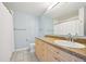 Well-lit bathroom features a modern vanity, sink, and clean finishes, perfect for everyday convenience at 5677 S Park Pl # 311A, Greenwood Village, CO 80111