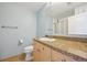 Bathroom features include granite countertop, modern fixtures, and neutral tile flooring at 5677 S Park Pl # 311A, Greenwood Village, CO 80111