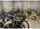 Secured bike storage room filled with a variety of bicycles, providing convenient and safe storage for residents at 5677 S Park Pl # 311A, Greenwood Village, CO 80111