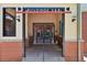Entrance to buildings A & B. The entrance is brick with iron gates and lighting fixtures at 5677 S Park Pl # 311A, Greenwood Village, CO 80111