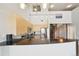 Modern kitchen with granite counters, stainless appliances and natural light, adjacent to a spiral staircase at 5677 S Park Pl # 311A, Greenwood Village, CO 80111
