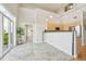 Bright kitchen with tile floors, high ceilings, and modern stainless steel appliances at 5677 S Park Pl # 311A, Greenwood Village, CO 80111
