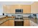 Well-equipped kitchen featuring modern stainless steel appliances and sleek granite countertops at 5677 S Park Pl # 311A, Greenwood Village, CO 80111
