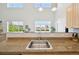 Bright kitchen featuring granite countertops and stainless steel appliances, with sunny views at 5677 S Park Pl # 311A, Greenwood Village, CO 80111