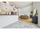 Bright living room features a fireplace, media center, and comfortable leather seating, perfect for relaxation at 5677 S Park Pl # 311A, Greenwood Village, CO 80111