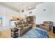 Open-concept living space showcases high ceilings, hardwood floors, and a modern kitchen with stainless appliances at 5677 S Park Pl # 311A, Greenwood Village, CO 80111