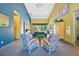 Bright lobby space includes modern seating and colorful decor at 5677 S Park Pl # 311A, Greenwood Village, CO 80111