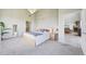 View of main bedroom with ensuite bathroom and featuring hardwood flooring at 5677 S Park Pl # 311A, Greenwood Village, CO 80111