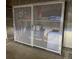Secure storage locker with mesh door in parking area, offering convenient space for residents' belongings at 5677 S Park Pl # 311A, Greenwood Village, CO 80111