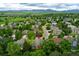 Stunning aerial view of home surrounded by lush greenery with mountain views, nestled in a desirable neighborhood at 2204 Lasalle St, Superior, CO 80027