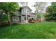 Large backyard featuring a well-maintained lawn, mature trees, and a wooden deck at 2204 Lasalle St, Superior, CO 80027