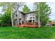 Expansive backyard features a spacious deck, lush lawn, perfect for outdoor activities and relaxation at 2204 Lasalle St, Superior, CO 80027
