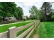 Fenced backyard with green grass, trees, and a pathway at 2204 Lasalle St, Superior, CO 80027