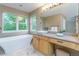 Bright bathroom with soaking tub, modern vanity, and ample natural light at 2204 Lasalle St, Superior, CO 80027