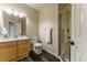 Bathroom with wood vanity, walk-in shower, and wood floors at 2204 Lasalle St, Superior, CO 80027