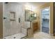 Modern bathroom with tiled walk-in shower, vanity, and walk-in closet at 2204 Lasalle St, Superior, CO 80027