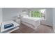 Cozy bedroom with a bright window, white wood trim, and white furnishings at 2204 Lasalle St, Superior, CO 80027