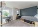 Bedroom featuring a sleek desk, built-in shelves, and modern furnishings, including a platform bed at 2204 Lasalle St, Superior, CO 80027