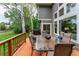 Outdoor deck featuring patio seating, grill, and views of the green backyard at 2204 Lasalle St, Superior, CO 80027