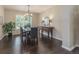 Dining room with hardwood floors, shutters, and a modern chandelier at 2204 Lasalle St, Superior, CO 80027