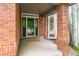 Inviting front porch with brick accents and a welcoming entrance at 2204 Lasalle St, Superior, CO 80027