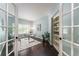 Bright home office with modern desk, built-in shelving, and French doors at 2204 Lasalle St, Superior, CO 80027