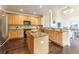 Bright kitchen features maple cabinets, granite counters, island, and stainless steel appliances at 2204 Lasalle St, Superior, CO 80027