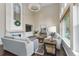 Elegant living room with tall ceilings, a fireplace, large windows, and stylish decor at 2204 Lasalle St, Superior, CO 80027