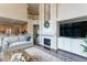 Open living room with fireplace and view of kitchen at 2204 Lasalle St, Superior, CO 80027