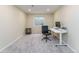 Bright office space with a sit stand desk, black chair, and neutral walls at 2204 Lasalle St, Superior, CO 80027