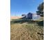 Spacious backyard with detached shop and pergola at 6255 Wolf Creek Rd, Strasburg, CO 80136