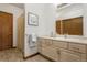 Bathroom featuring vanity with storage, shower curtain and neutral decor at 7040 Routt St, Arvada, CO 80004