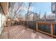 Outdoor deck area features wood flooring, railing, and decorative metal arch at 7040 Routt St, Arvada, CO 80004