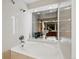 Elegant bathroom featuring a sleek bathtub and decorative vases, creating a serene and stylish bathing space at 7548 S Crocker Ct, Littleton, CO 80120