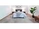 Bright bedroom featuring a comfortable bed with bedside tables and lamps creating a cozy atmosphere at 7548 S Crocker Ct, Littleton, CO 80120