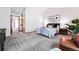 Bright bedroom featuring neutral tones, a comfortable bed, and a cozy seating area perfect for relaxation at 7548 S Crocker Ct, Littleton, CO 80120