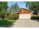 Charming home featuring a two-car garage and manicured landscaping at 7548 S Crocker Ct, Littleton, CO 80120