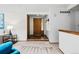 Bright foyer with stylish front door, carpet flooring, and a coat closet offers a warm welcome at 7548 S Crocker Ct, Littleton, CO 80120