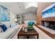 Spacious living room with vaulted ceilings, a cozy fireplace, and stylish decor at 7548 S Crocker Ct, Littleton, CO 80120
