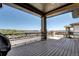 Spacious covered balcony with black railings providing panoramic neighborhood views at 365 Casalon Pl, Superior, CO 80027