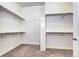 Walk-in closet with white shelving, carpet flooring, and built-in storage solutions at 365 Casalon Pl, Superior, CO 80027