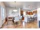 Open-concept dining area features hardwood floors and flows seamlessly into the modern kitchen at 365 Casalon Pl, Superior, CO 80027