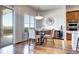 Bright dining area features hardwood floors, view, and a modern light fixture at 365 Casalon Pl, Superior, CO 80027
