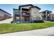 Stunning two-story home with stone accents, lush landscaping, and multiple outdoor balconies at 365 Casalon Pl, Superior, CO 80027